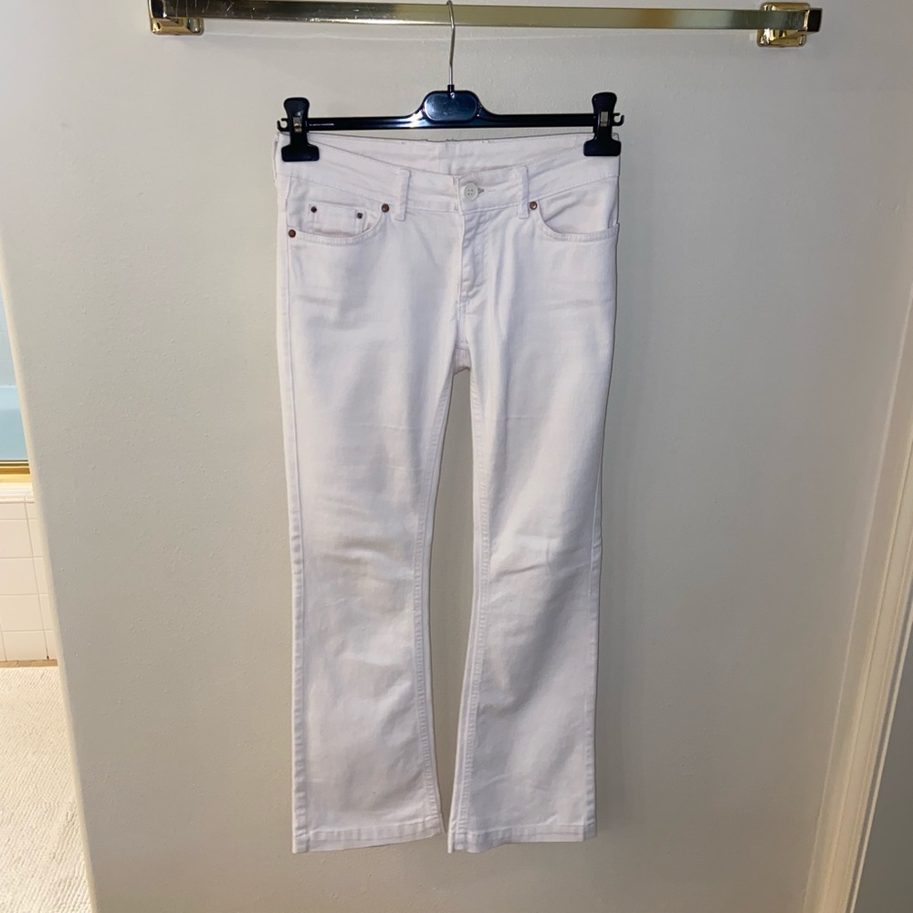 White low rise flared jeans.